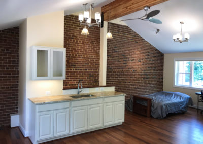 Wet Bar for In-law Suite adds functionality in this well lit space from windows on two sides